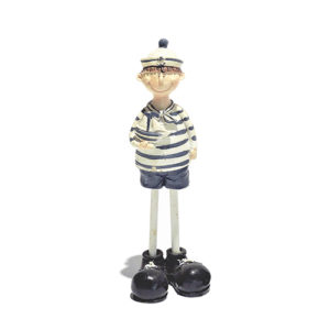 Little Sailor Boy Figurine - Ceramic collectible featuring a charming boy holding a toy boat. Perfect for nautical-themed decor.