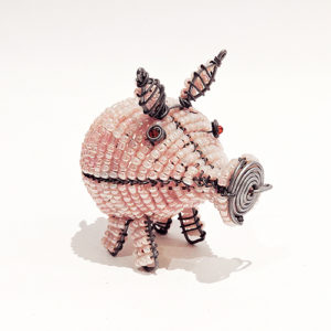 Bead and wire sculpture of a pink piggy, crafted with beads and wire, showcasing intricate details and charming design.