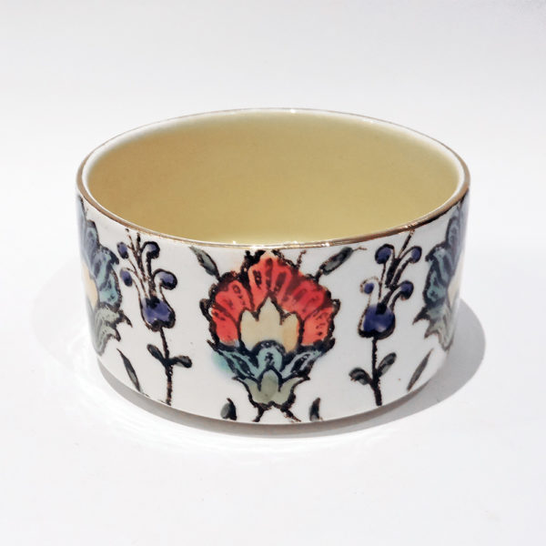 Handmade floral ceramic bowl with intricate patterns and gold-plated edges, perfect for adding elegance to your tableware collection.