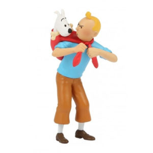 Tintin and Snowy figurine from "Prisoners of the Sun" - Tintin holding Snowy on his back with a red cloth.