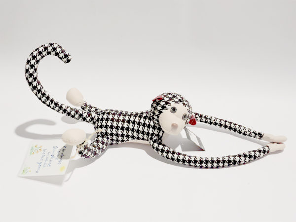 An image of a Hanging Monkey Plush Toy with extra-long arms, available in solid grey or houndstooth pattern. Size: 56cm.